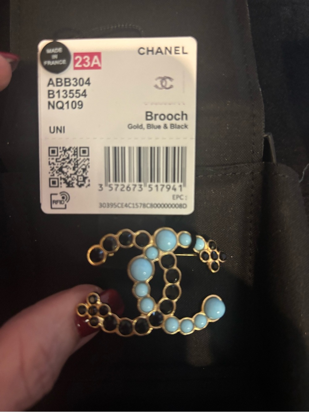 CHANEL Gold Brooch with Light Blue and Black Accents